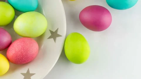 4K view of colorful Easter eggs on a plate Stock Footage 233455508