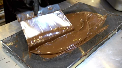4K view of confectioner prepares melted chocolate for production. Stock-Footage 88787903