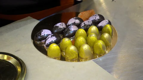 4K view of confectioner puts chocolate candy on a tray Stock Footage 99169037