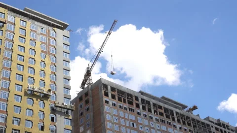 4K view of the construction hoists with workers and construction crane Stock Footage 114294597