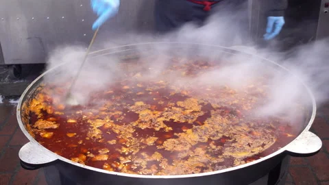 4K view cook's hand stirring vegetable soup. Stock Footage 101463514