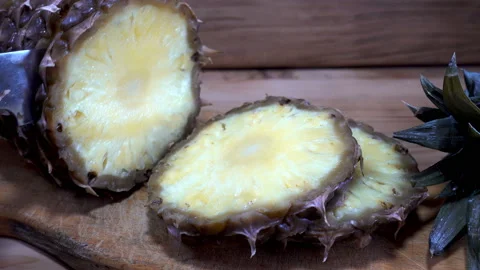 4K view of cutting pineapple into slices with a knife Stock Footage 86529435