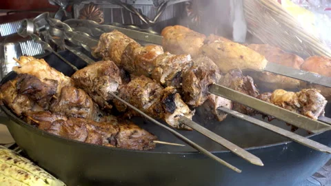 4K view of delicious fried pieces of meat on skewers. Stock Footage 101470658