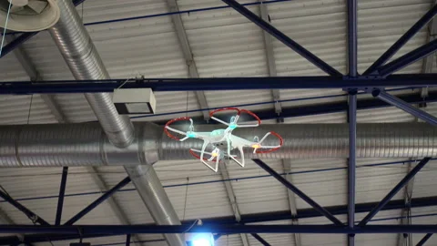 4K view of demonstration flight of a drone or quadrocopter inside the building Stock Footage 87334594