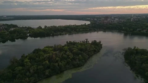 4K View From Drone Flying Over Lake Of The Isles Minneapolis At Sunset Stock Footage 220469694