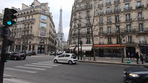 4K, View of Eiffel Tower from a street with old houses and traffic in Paris.-Dan Stock Footage 106910942