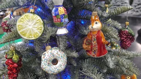 4K view of a fox and candies and a donut on a Christmas tree. Stock Footage 253114901