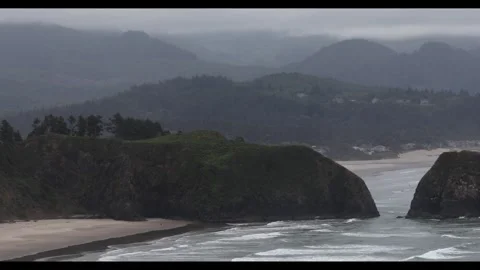 4K view of a gloomy cloudy sunrise over Cannon Beach, Pacific ocean, Oregon, USA Stock-Footage 339311442