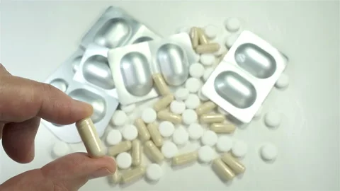 4K view of a hand holding a pill Stock Footage 140163665