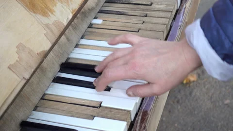 4K view of a hand playing of an old piano Stock Footage 153255944