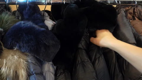 4k view of hand takes off the coat from the rack. Stock Footage 117342201