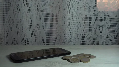 4K view of a hand taking a mobile phone from the table Stock Footage 130430704