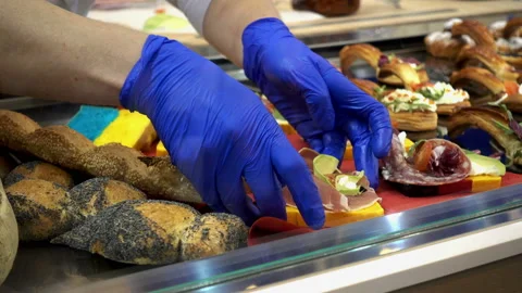 4K view of the hands of cooks putting ready snacks on the counter Stock Footage 89667816