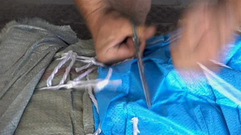 4k view of hands cut with scissors the ropes on the packaging Stock Footage 115781600
