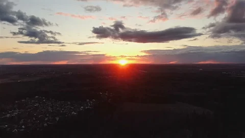 4K view has beautiful clouds in orange at sunset from a great height Video stock 128335916
