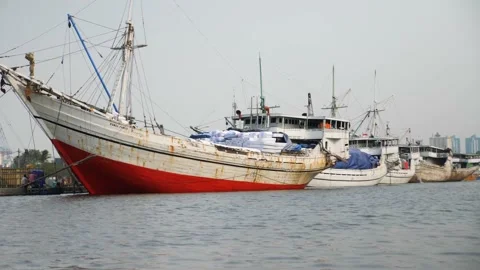 4K view of Local Indonesians working on a Pinisi wooden boats, Sunda Kelapa. Stock Footage 163169435