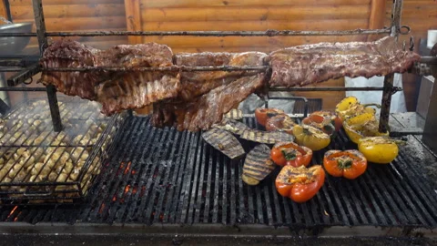 4K view of meat ribs being cooked on a grill Stock Footage 170605119