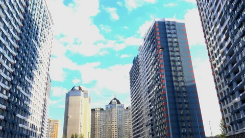 4K view of modern high-rise city buildings in cloudy sky. Stock Footage 130508289