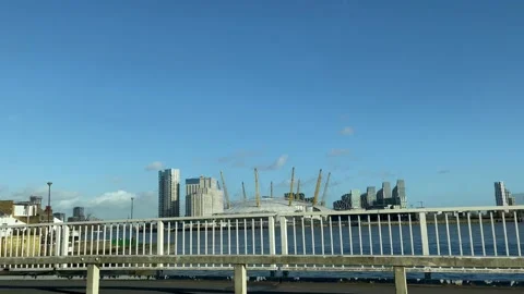 4K view of The O2 from blue bridge with cyclist passing by Stock Footage 221921579