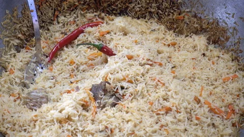 4K view of pilaf in a large cauldron Stock Footage 124795824
