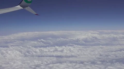 4K, View of plane wing through airplane window in flight trip. Plane flying-Dan Stock Footage 134279834