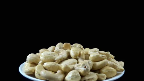 4K view of a plate full of cashew nuts rotated Stock Footage 137200734