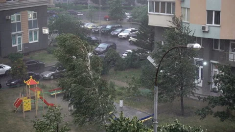 4K view of rain and wind in a city courtyard. Stock Footage 138292147