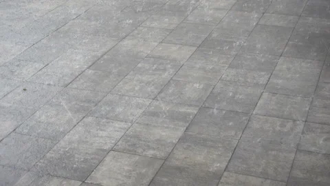 4K view of rain on pavement tiles. Stock Footage 213345304