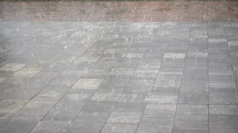 4K view of rain on a sidewalk. Stock Footage 166092196