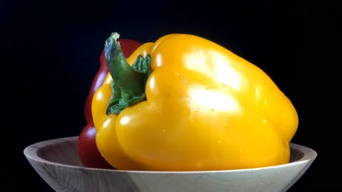 4K view of a red and yellow whole bell pepper Stock Footage 196067939