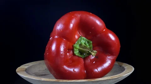 4K view of red bell pepper rotating on plate Stock Footage 139049487