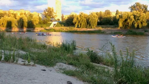 4k view of the river with floating kayaks Stock Footage 137492991