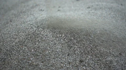 4K view of sand trickle pours and forms a hill. Stock Footage 114294087