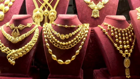 4K view of a set of gold necklaces, chains and bracelets Stock Footage 86347550