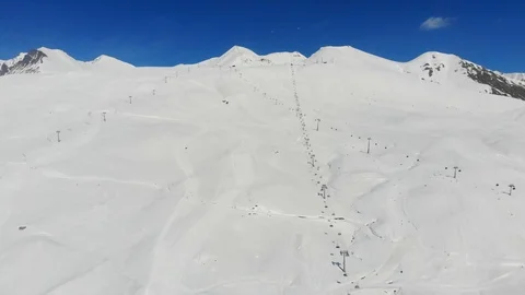4k view of ski slope in Alps, lifts from the bottom Video stock 112219519