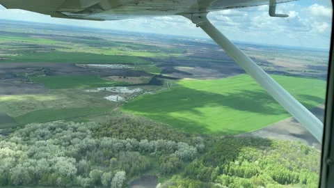 4K View from small airplane on clouds and landscape. Stock Footage 155587139