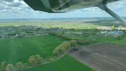 4K View from small plane on clouds and landscape. Stock Footage 156119680