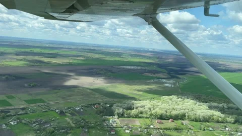 4K View from small plane on clouds and landscape. Video stock 157158392