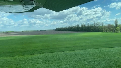 4k View from small propeller airplane on green field. Stock Footage 154761955