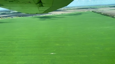 4k View from small propeller airplane on green field. Stock Footage 154932432