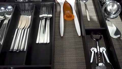 4K view of spoons, forks and other cutlery in a modern cutlery box drawer. Stock Footage 87331009