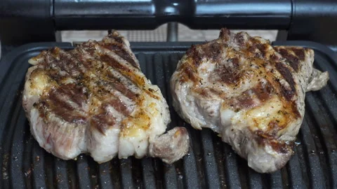 4K view of steaks being grilled. Stock-Footage 196062173