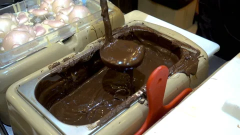 4K view of stirring warm chocolate by a professional confectioner Stock Footage 89669978