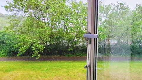 4K View Through Open Window of Heavy Rain Over Trees in Denmark Stock Footage 337195953