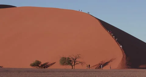 4K view of tourists climbing dune 45 Stock Footage 64698803