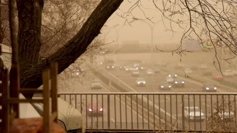 4K View of traffic during a sandstorm in Beijing, China. Stock Footage 150510307