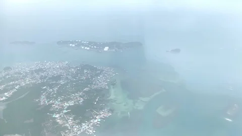 4k. view from window of flying airplane see the earth below the plane is lowerin Stock Footage 123458097