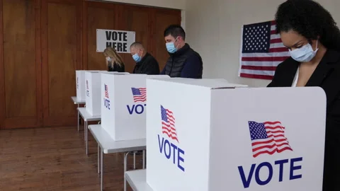 4K: Voters voting at Polling Place of the USA Election. People wear Face Masks. Stock Footage