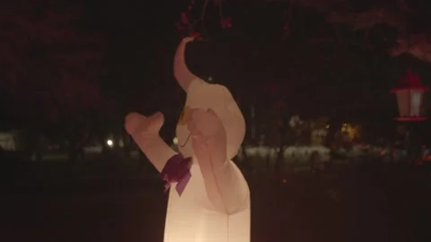 4K wacky inflatable ghost giant pumpkin halloween trick or treat Stock Footage 149720412