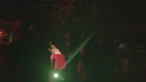 4K wacky inflatable ghost kid pumpkin halloween trick r treat Stock Footage 149718831